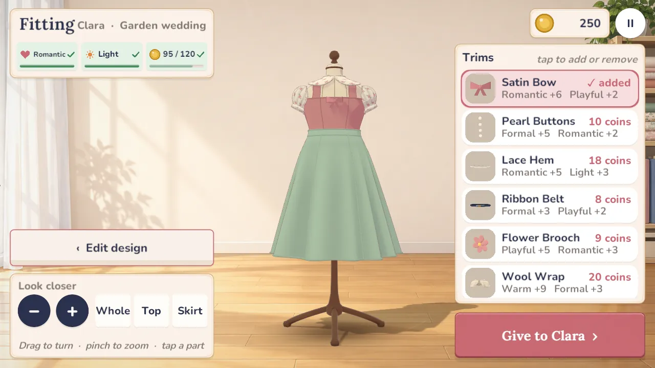 The dress on a form in the fitting room with a satin bow added